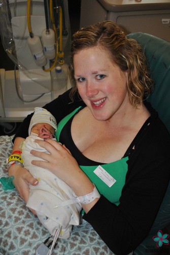 A mother holding a baby in the NICU. Logo: Houston moms Blog. 