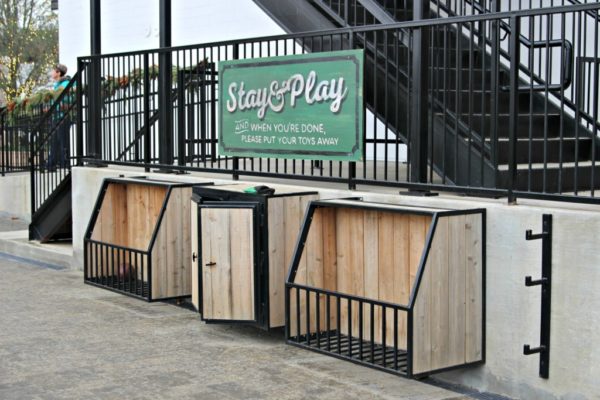 Two bins for toys with a sign: Stay and Play. 