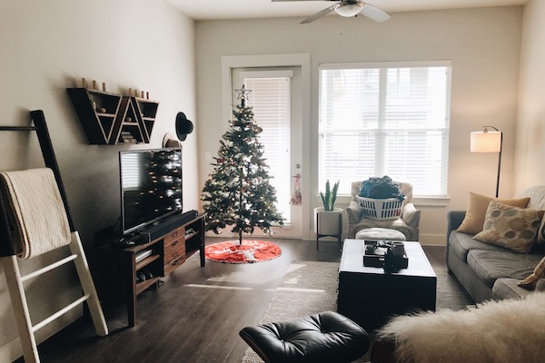 A living room with a Christmas tree.