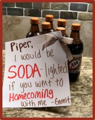 A six-pack of A & W with a note with the text: Piper, I would be soda-lighted if you went to homecoming with me. Garrett. 