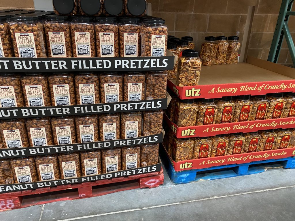 Large containers of pretzels and crackers. 
