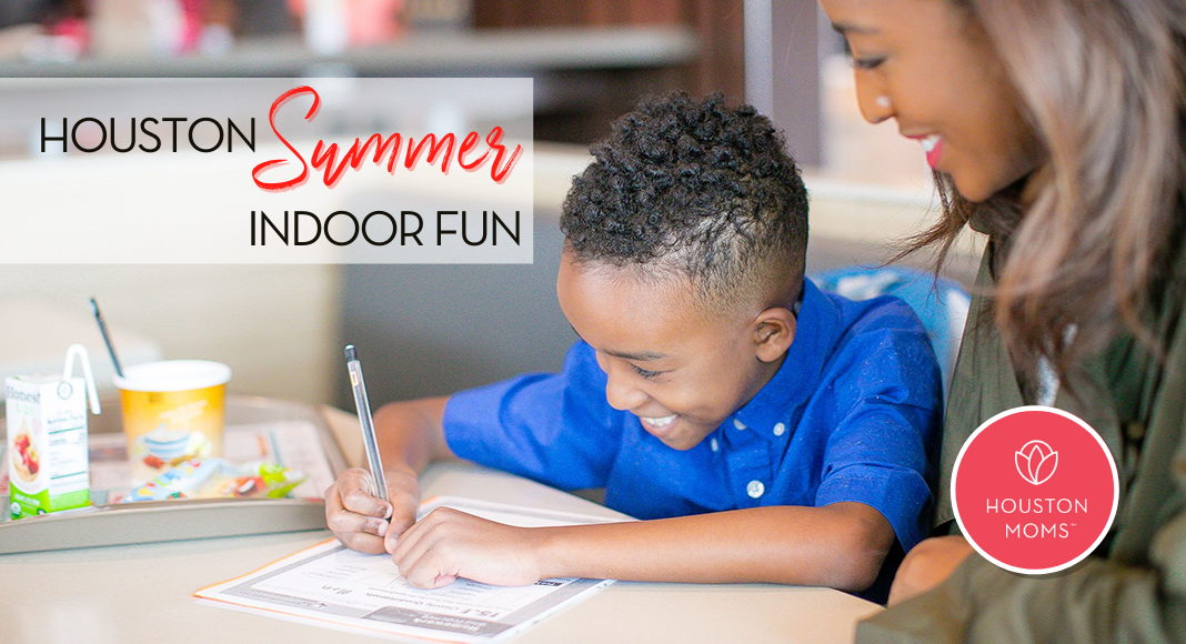 Houston Summer Indoor Fun. A photograph of a mother watching a son write. Logo: Houston Moms.