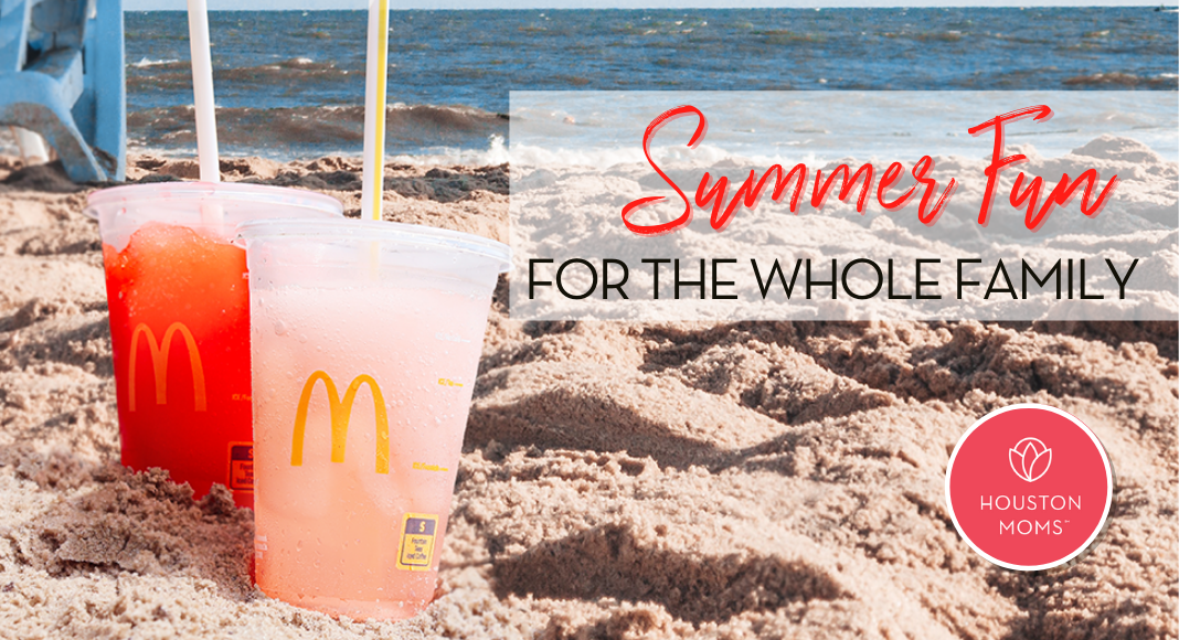 Summer Fun for the whole family. A photograph of Two McDonald's drinks in the sand at a beach. Logo: Houston moms.