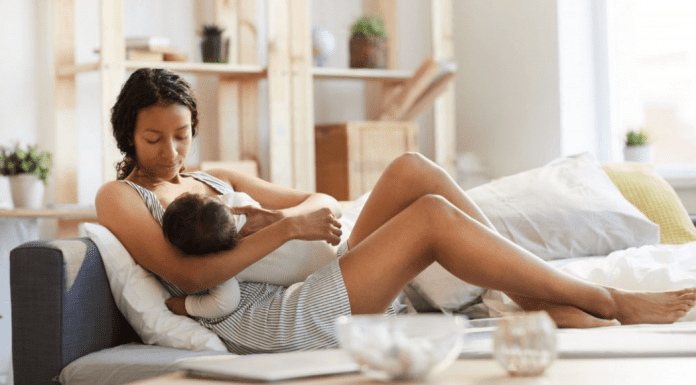A woman breastfeeding a baby.