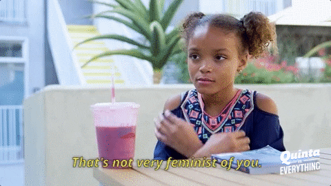 A GIF of a girl crossing her arms with the text That's not very feminist of you. 