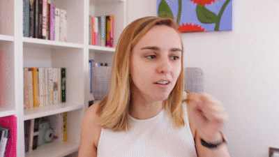 A GIF of a woman coughing with the text *cough* patriarchy. 