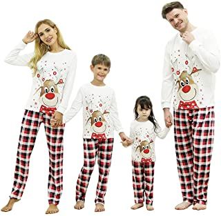 Family of 4 in matching plaid and reindeer pajamas