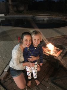 Mom spending one-on-one time with her son at a fire pit