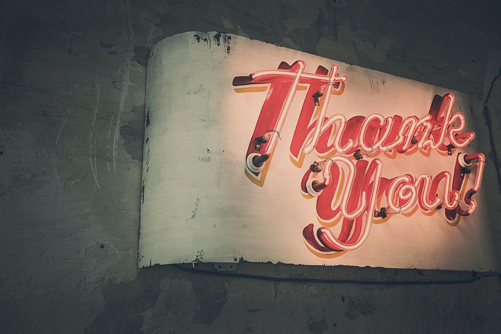 Neon sign with the text: Thank You.