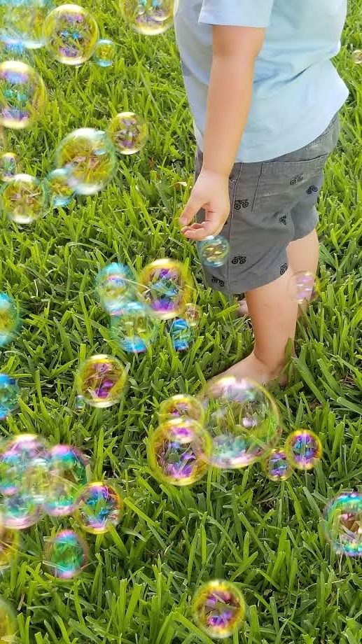 bottom half of boy surrounded by bubbles