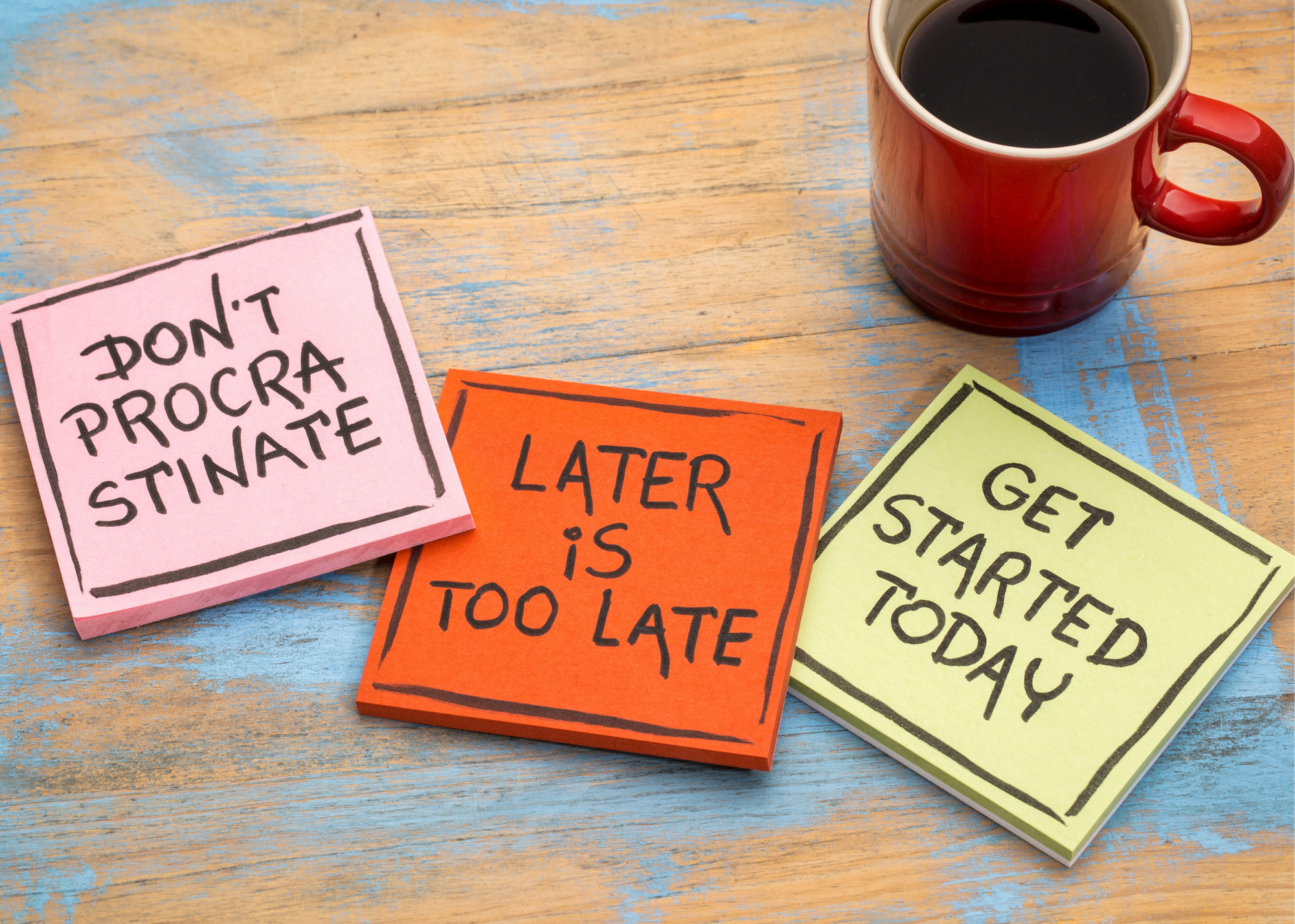 coffee mug surrounded by sticky notes that say "Don't Procrastinate", "Later is too late" and "Get started today"
