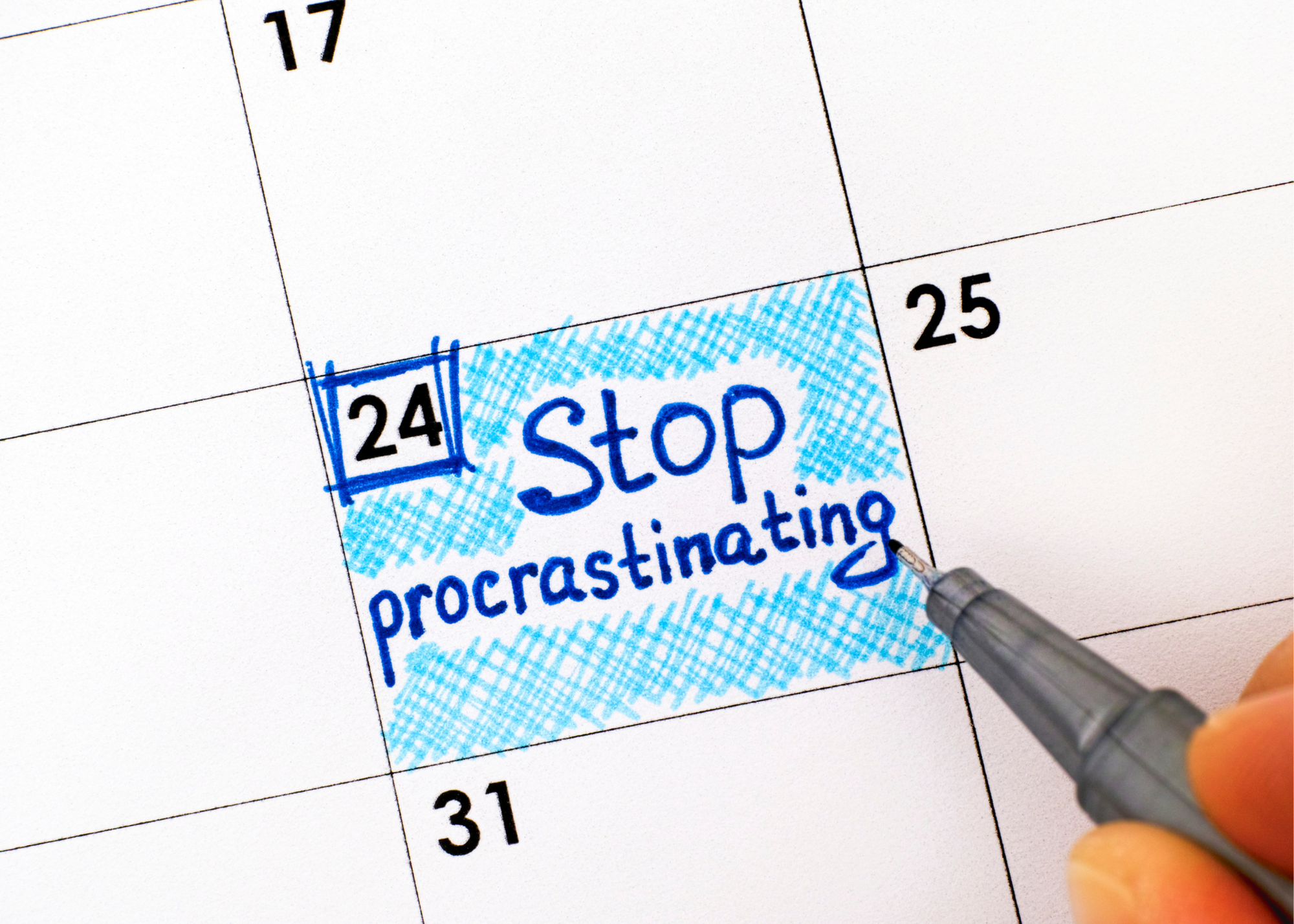 calendar with 24 box colored in with the words "Stop procrastinating"