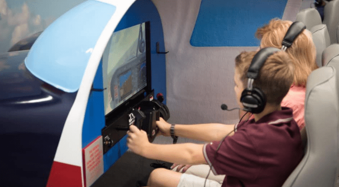 kids on flight simulator