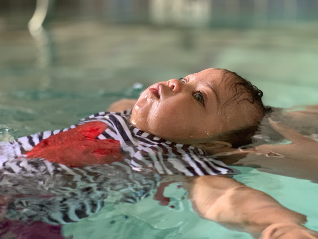 baby floating during survival swim lessons
