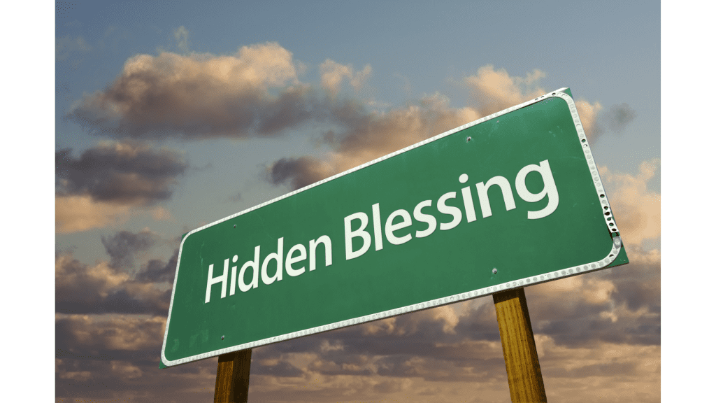 road sign that reads "Hidden Blessing"