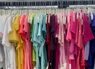 rack of thrifted colorful shirts