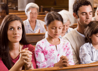 woman in church pew with family
