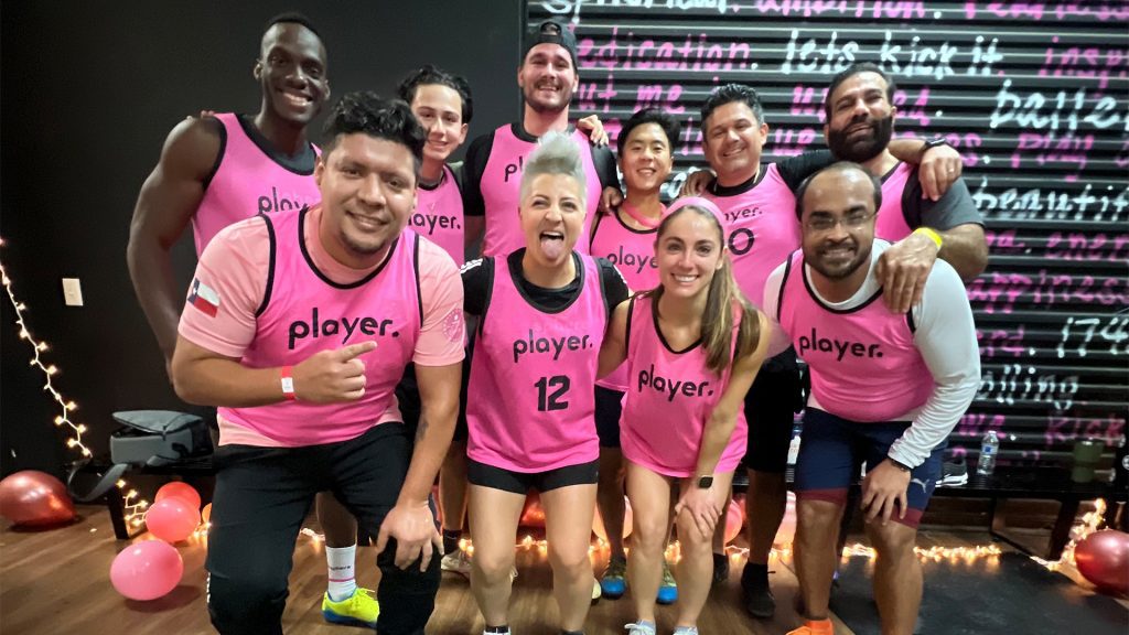 group of teammates wearing pink jerseys