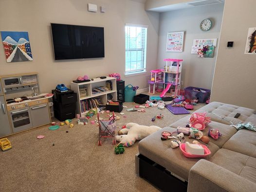 playroom with toys strewn about