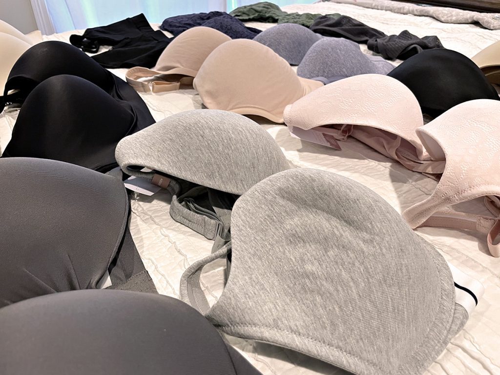 bras lined up on bed