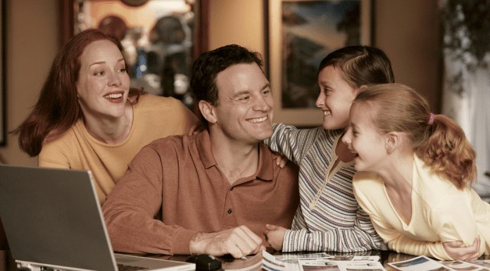family planning a vacation is all smiles around the table