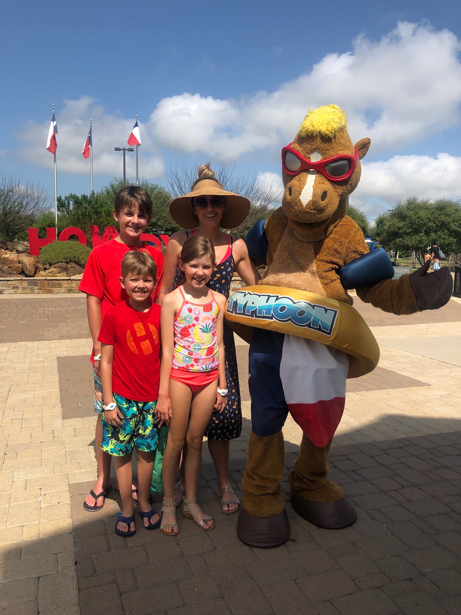 Family at Typhoon Texas waterpark with their mascot