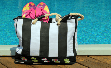 striped pool bag with flip flops sticking out