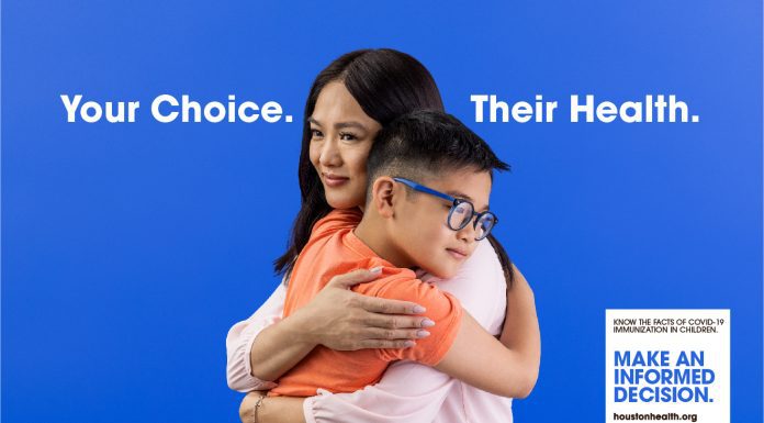 Asian woman hugging child