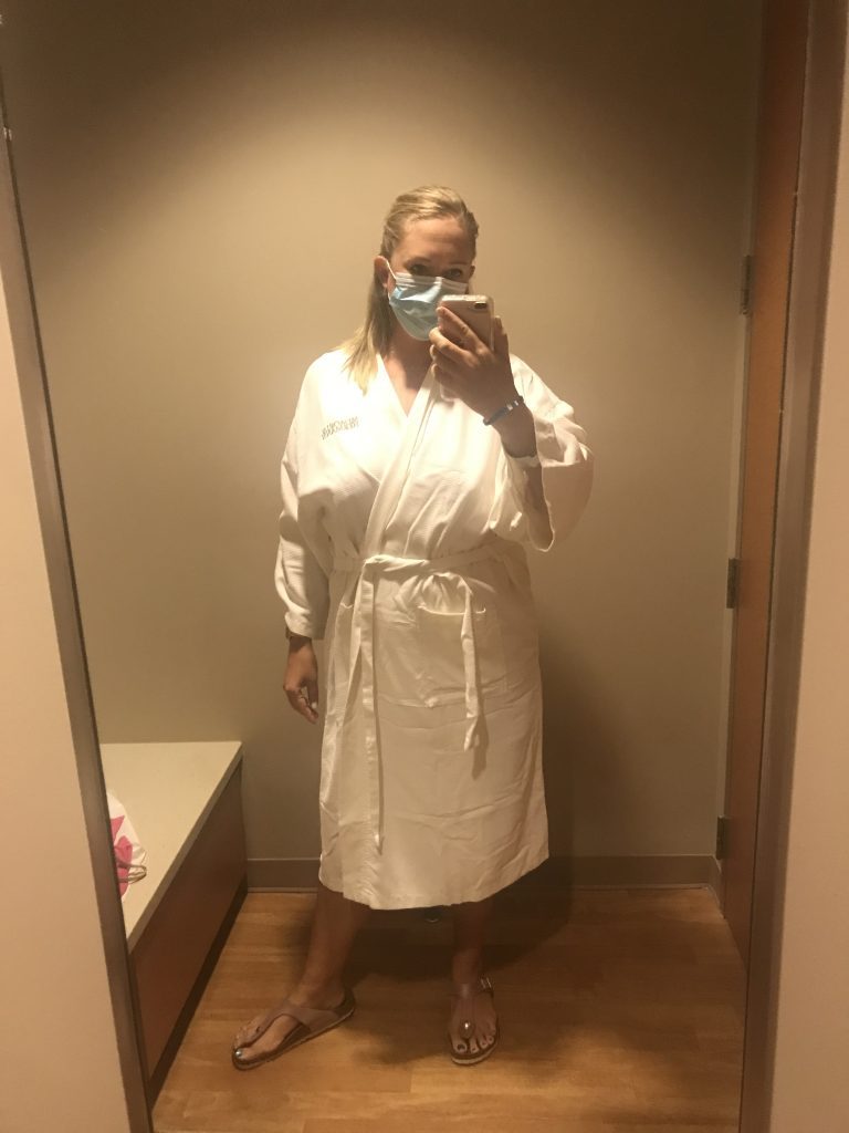 woman in robe ready for her mammogram to screen for breast cancer