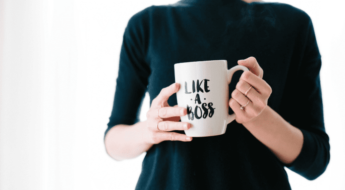 woman holding mug that says "Like a Boss"