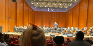 child watches Houston Symphony perform