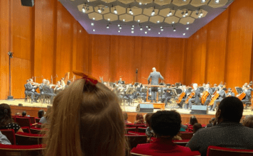 child watches Houston Symphony perform
