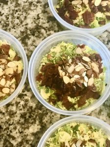 containers of brussels sprout salads