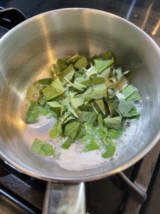 sage in pot with melted butter
