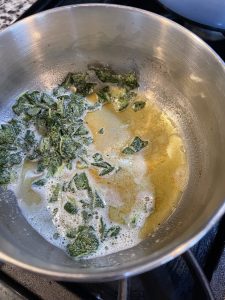 sage in pot with melted butter 