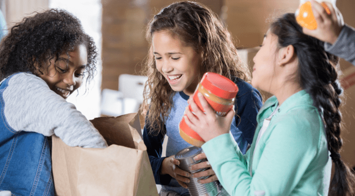 kids packing food in sacks